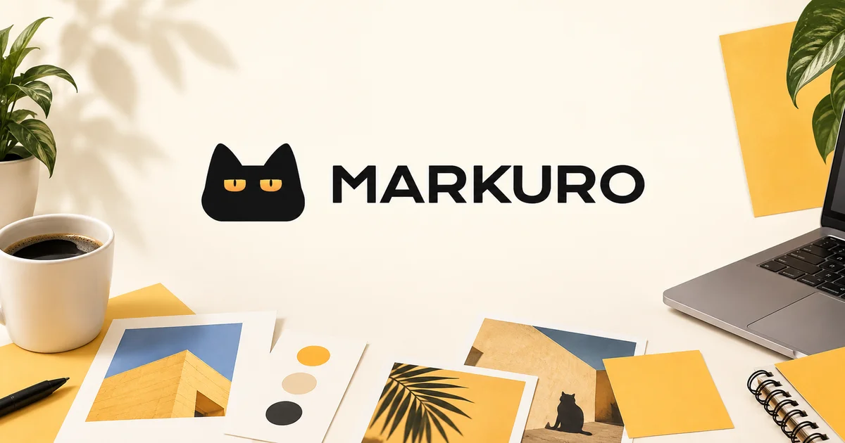 Markuro cat logo above campaign moodboards, a laptop and coffee in a warm creative workspace