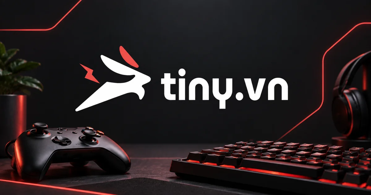 Tiny.vn logo above a controller, keyboard and headphones on a red-lit gaming desk